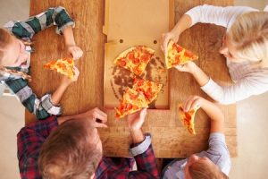 family eating pizza